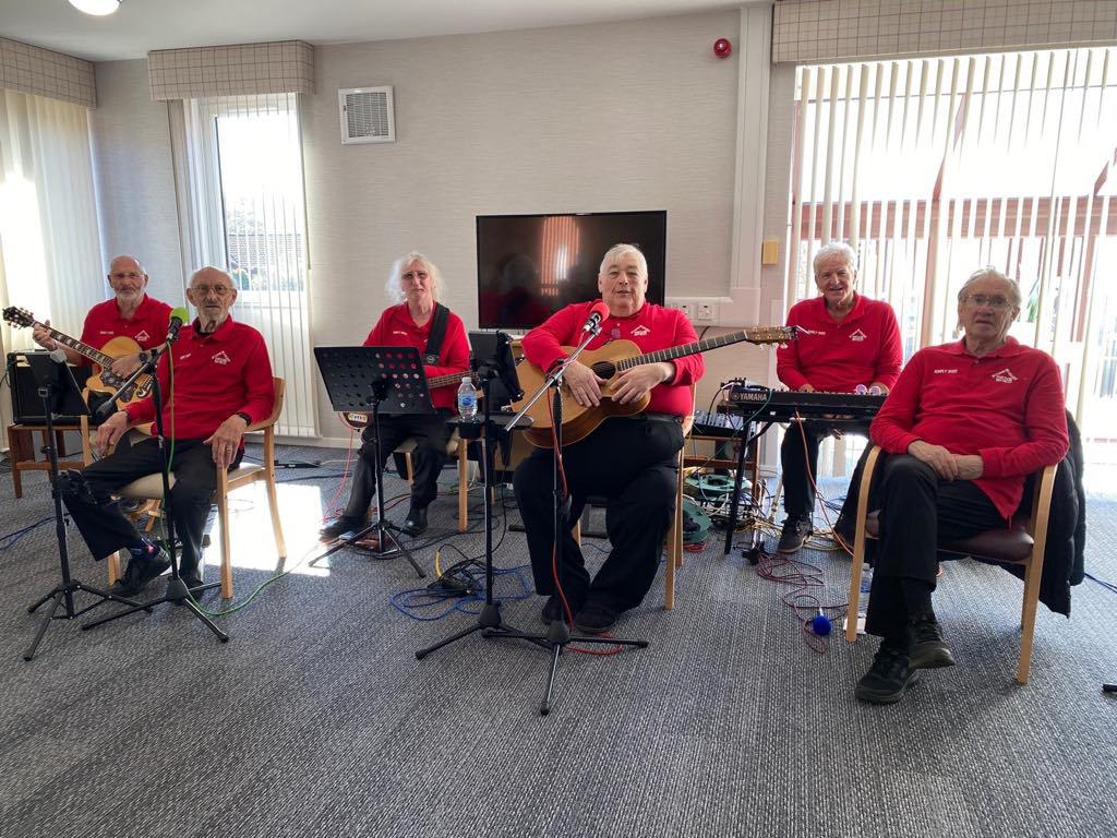 Members of the Simply Shed band relaxing and chatting